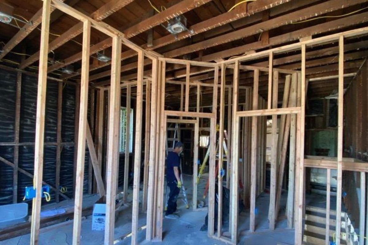 A room being built with wood framing and wooden beams.