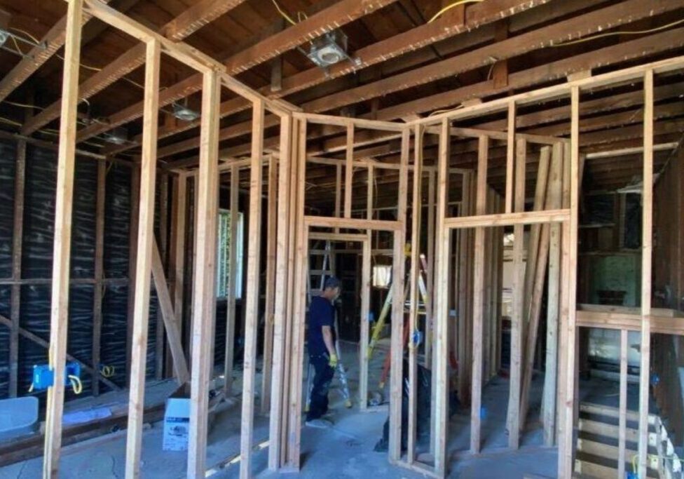 A room being built with wood framing and wooden beams.